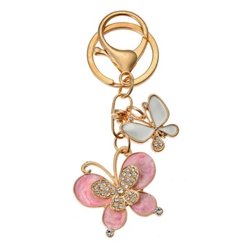 Fém kulcstartó 2 pillangós, üveggyönggyel, 4x1x3cm, CLEEF.JZKC0186